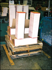 Figure 33. Notice multiple pallets to elevate signatures. Care must be  taken to limit the height of signature  piles to about shoulder height.
