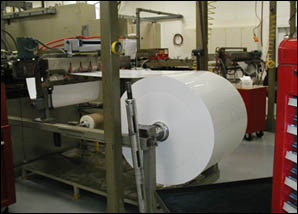 Figure 7. Roll stand with roll stock. Rotating shaft is properly nested in groove.