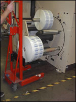Figure 33. Remove rolls of material with a mechanical lift.