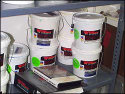 Figure 15. Containers of ink are in a manageable size, stored at an appropriate height, and equipped with handles for easy carrying.