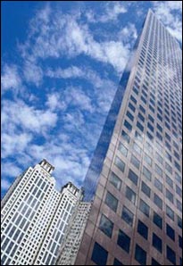 Two skyscrapers covered by light clouds; Sometimes it is safer to stay in your building rather than evacuate.