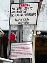 Figure 11: SCP report and other warning signs at gangway entrance to vessel