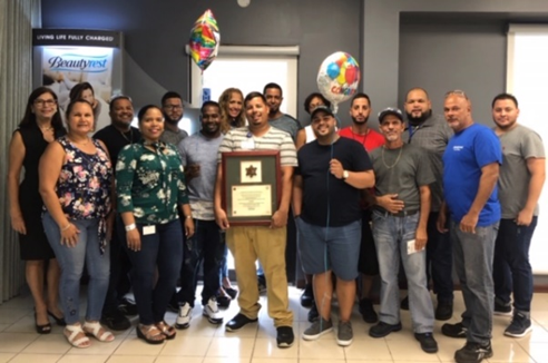 Simmons Caribbean Bedding employees with their SHARP plaque.