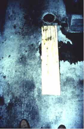 Image of uncovered floor drain