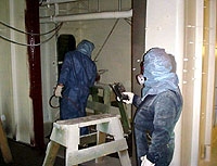 Figure 4: Shipyard Competent Person testing flammability and other hazards in spray area