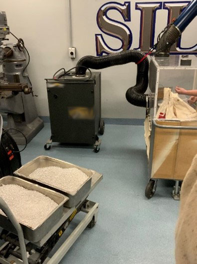 Opening bags of silver in enclosures fitted with the permanently installed and portable exhaust systems