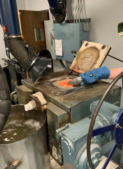 A permanently installed exhaust system was used to control exposure when pouring the melted silver into a cold-water bath