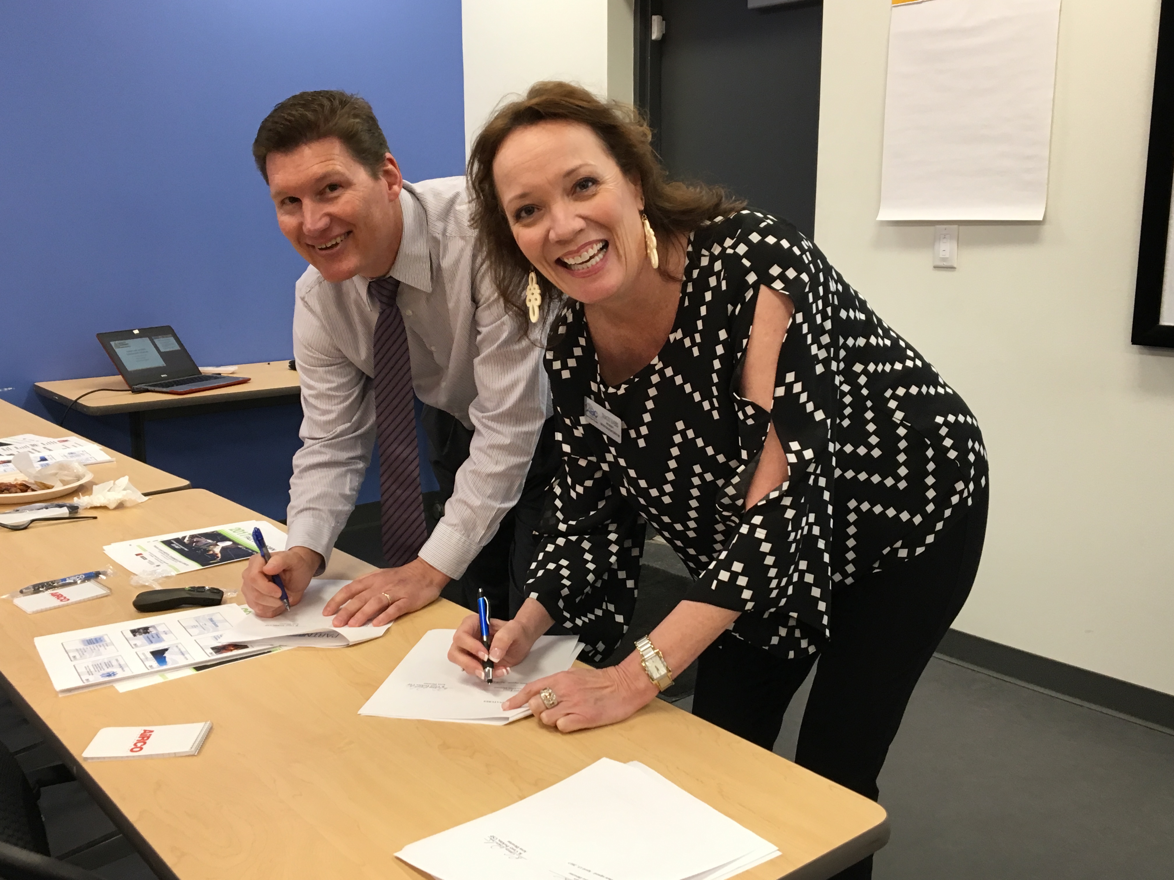 Casey Perkins, OSHA Area Director and Tracy Evers, Executive Director of the Associated Builders and Contractors, Central Texas Chapter renew their OSHA/ABC partnership.