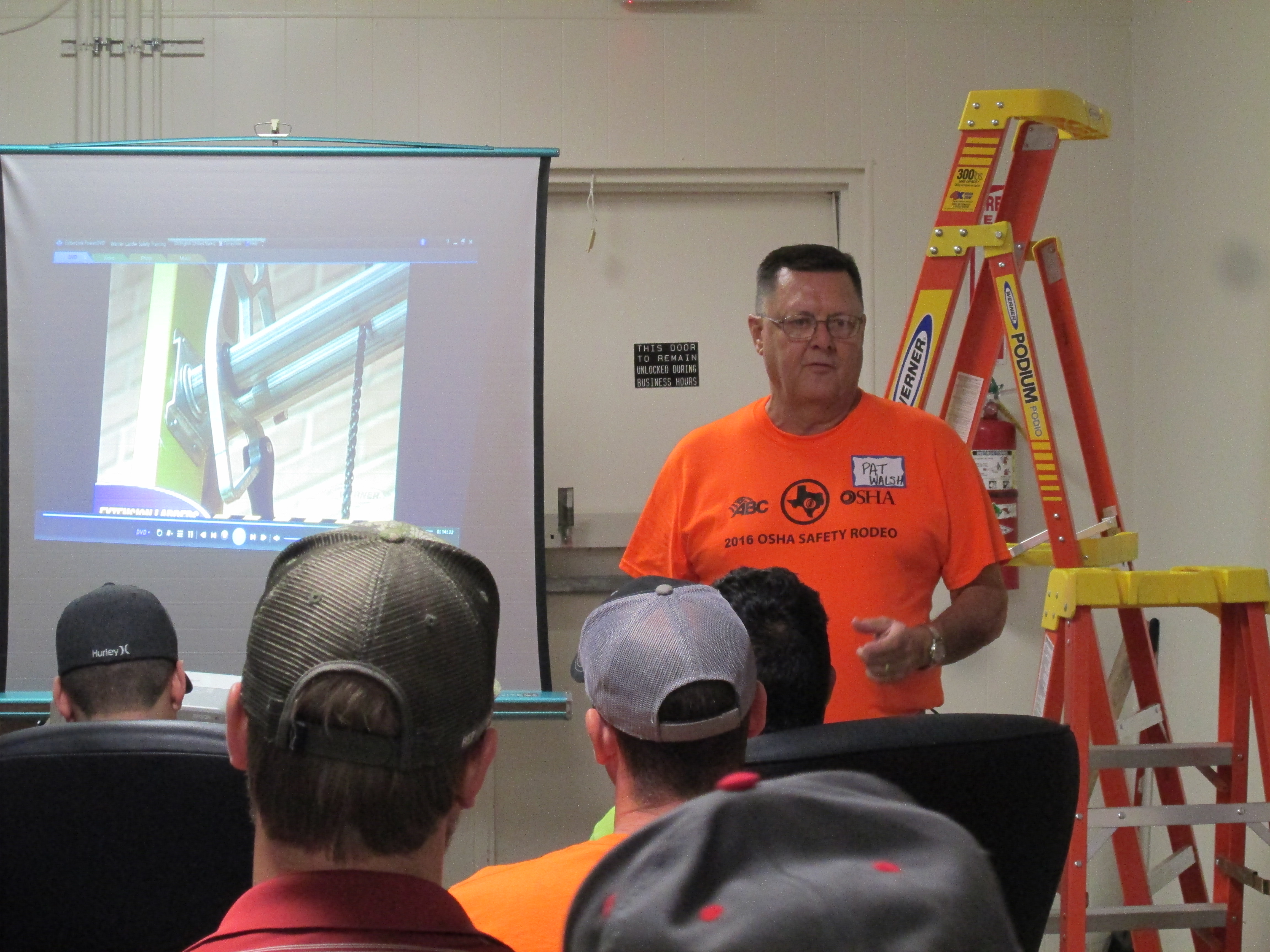 Pat Walsh trains workers on ladder safety at the Safety Rodeo.