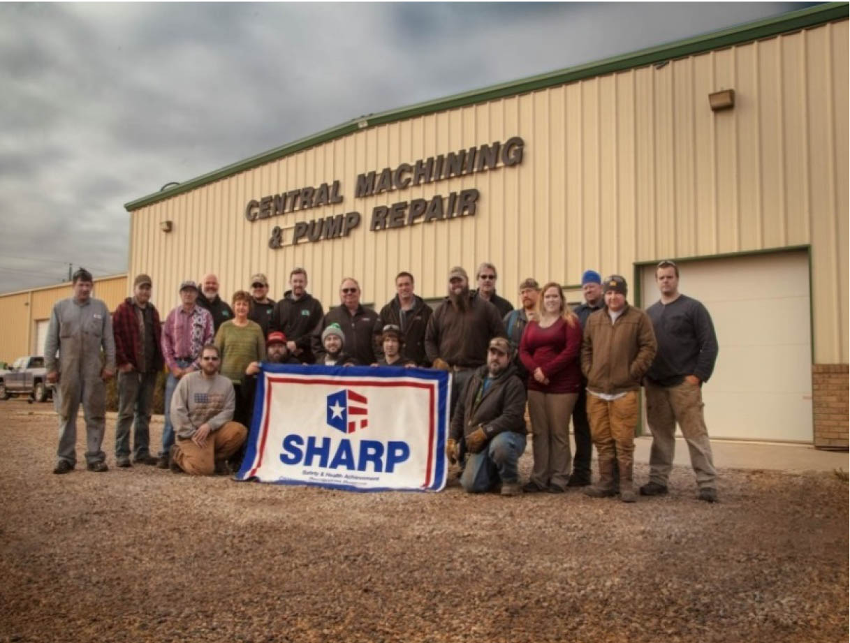 CMP Employees Holding SHARP Flag
