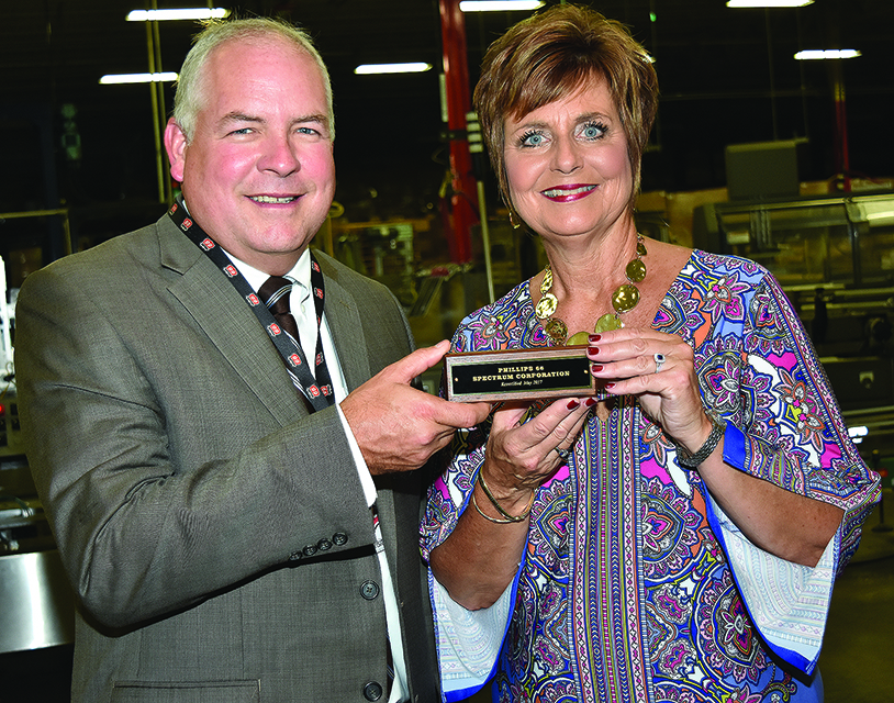 TOSHA Administrator Steve Hawkins presenting the recertification plaque to Mary Howerton, Plant Manager