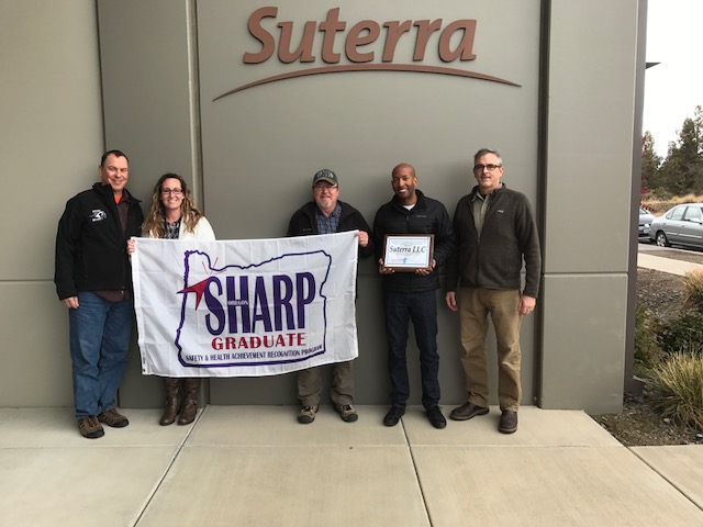 (Left to right) Cory Stengel (Oregon OSHA health consultant); Amber Hofer (Suterra plant safety manager); Randy Nice (Oregon OSHA safety consultant); Aman Khapoya (Suterra vice president of global operations); Kevin Kilroy (Oregon OSHA field consultation)