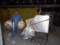 Figure 14: Worker removing trash from work area