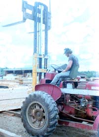 Powered industrial truck. Note the lack of an overhead guard for the operator.