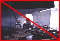 Figure 5: Improper practice - Workers on small float must wear PFD