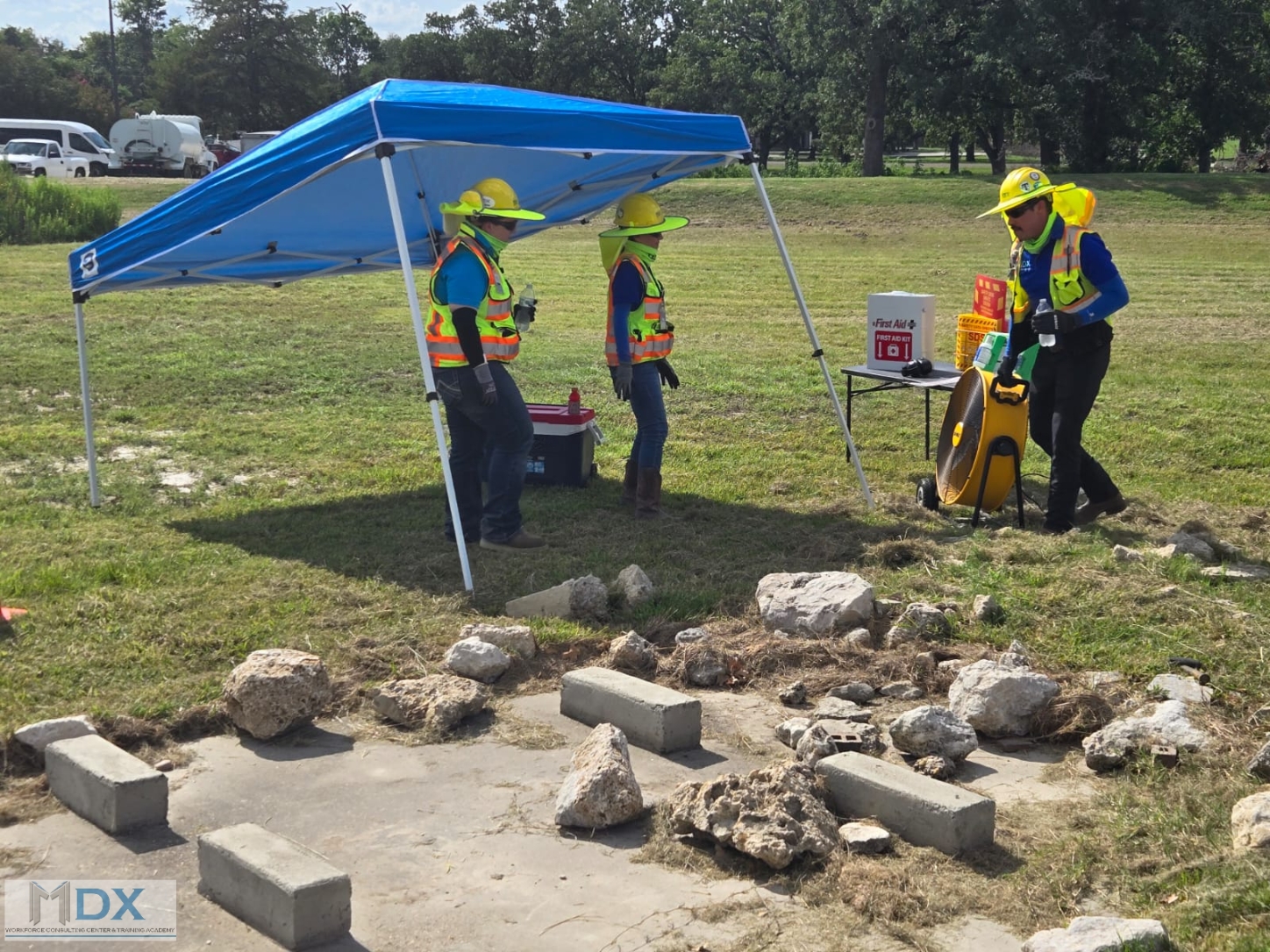 MDX Workforce Consulting Center & Training Academy : crew is using an adjustable canopy structure to maximize shade coverage