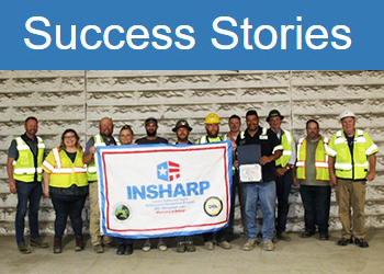 New Albany River Metals employees standing with their SHARP flag