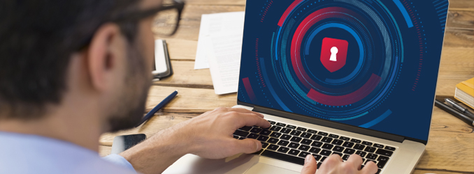 Young man accessing the Injury Tracking Application on laptop