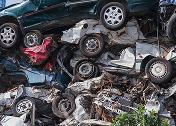 Crushed cars in a salvage yard pile
